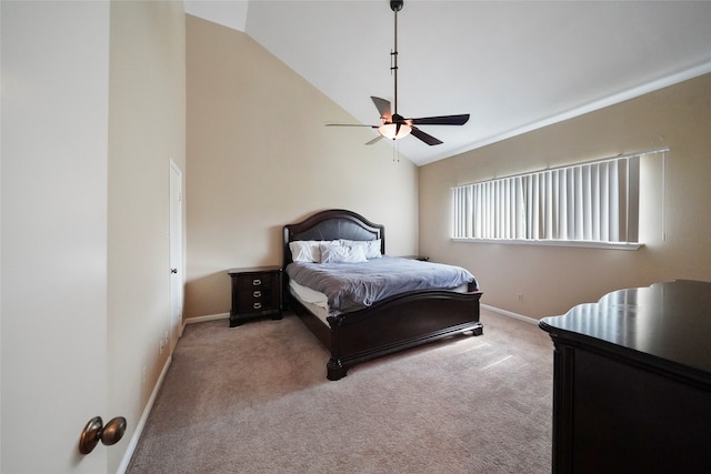 carpeted bedroom with ceiling fan and high vaulted ceiling