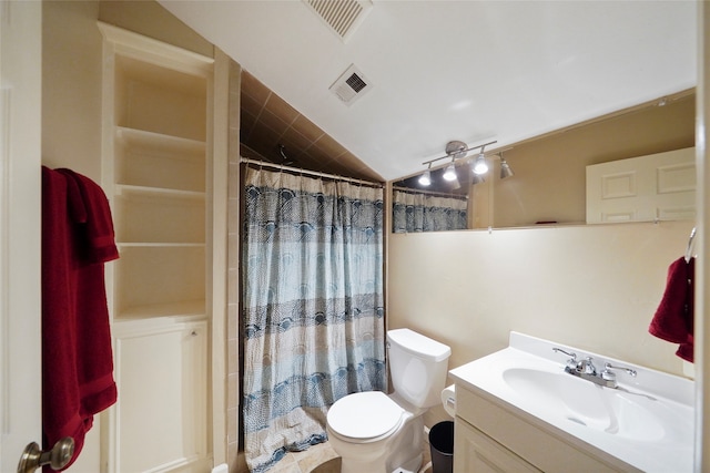 bathroom with vanity, a shower with shower curtain, vaulted ceiling, and toilet