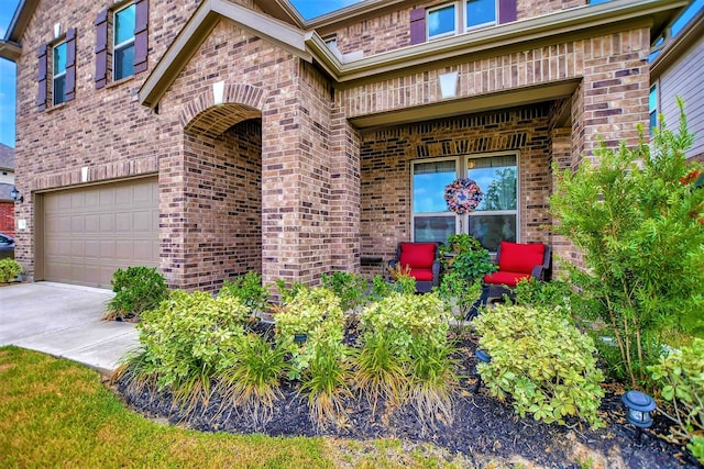 view of exterior entry with a garage