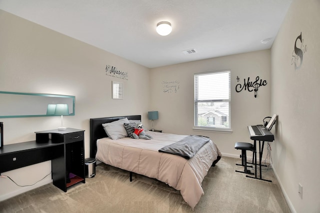 bedroom with light carpet