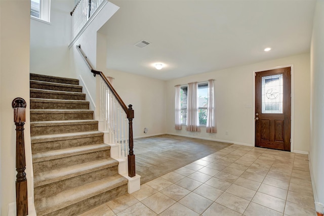 view of carpeted foyer