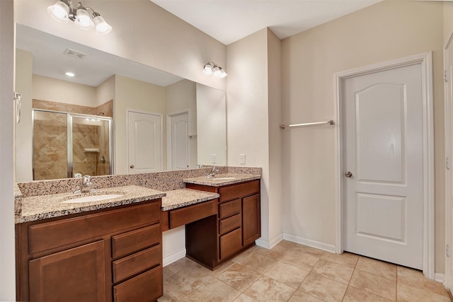 bathroom with vanity and an enclosed shower