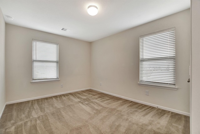 view of carpeted spare room