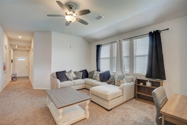 carpeted living room with vaulted ceiling and ceiling fan