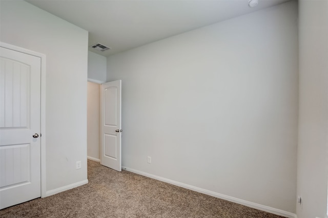 unfurnished bedroom featuring light colored carpet