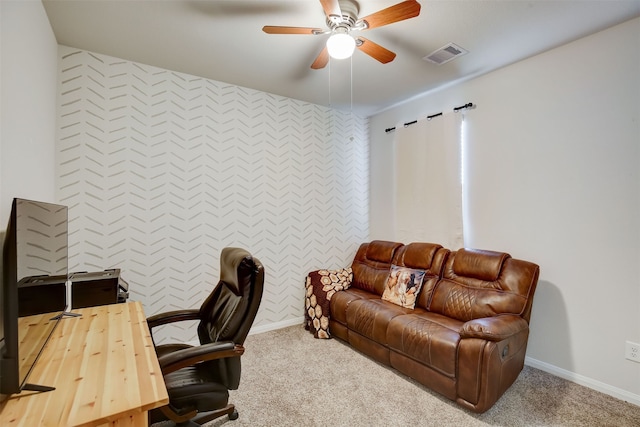 carpeted office featuring ceiling fan