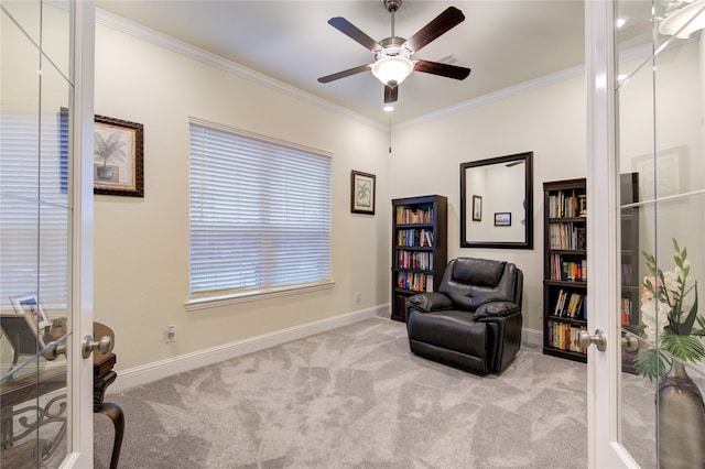 sitting room featuring light colored carpet and french doors