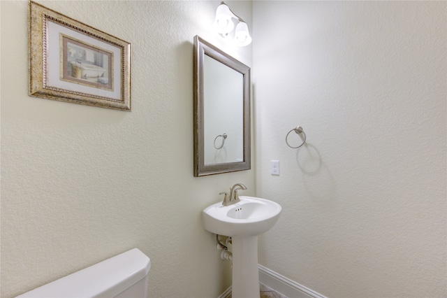 bathroom featuring toilet