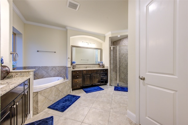 bathroom featuring ornamental molding, shower with separate bathtub, tile patterned floors, and vanity