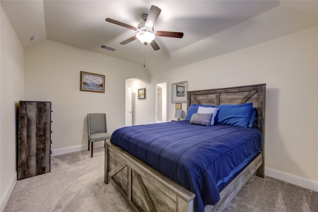 carpeted bedroom with lofted ceiling and ceiling fan