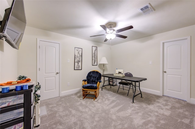 living area featuring ceiling fan and light carpet