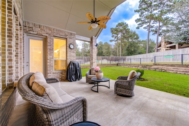 view of patio featuring ceiling fan