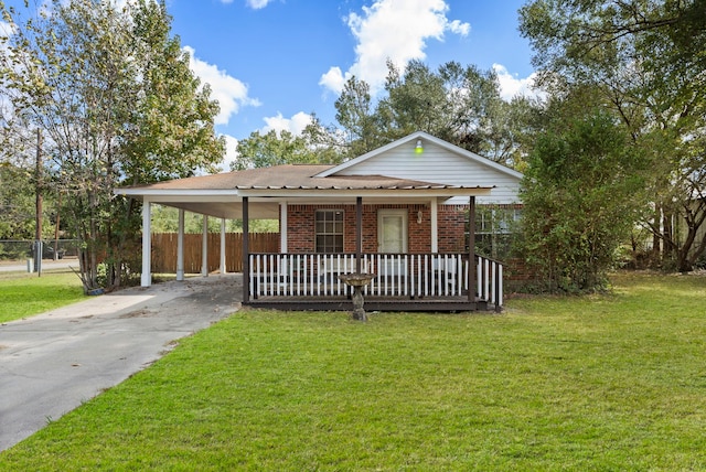 view of front of house featuring a front lawn, a deck, and a carport