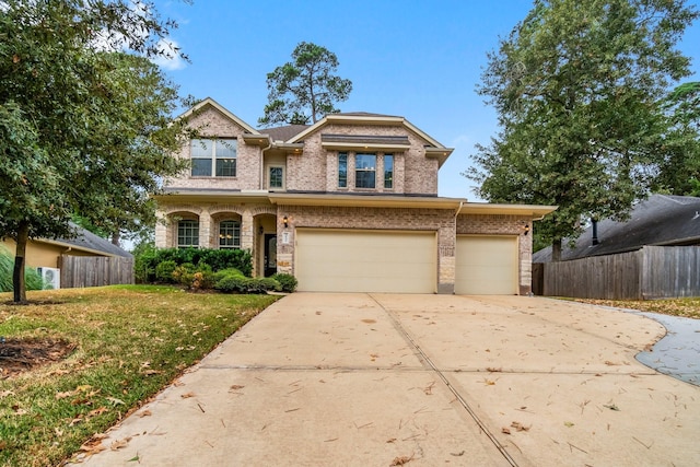 view of front of house with a front yard and a garage