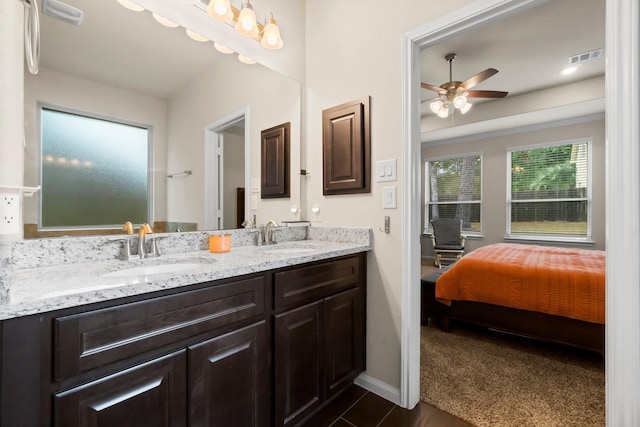 bathroom featuring ceiling fan and vanity