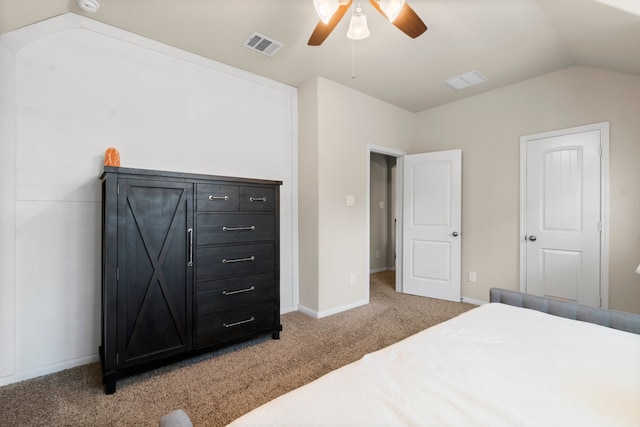 carpeted bedroom with ceiling fan and lofted ceiling