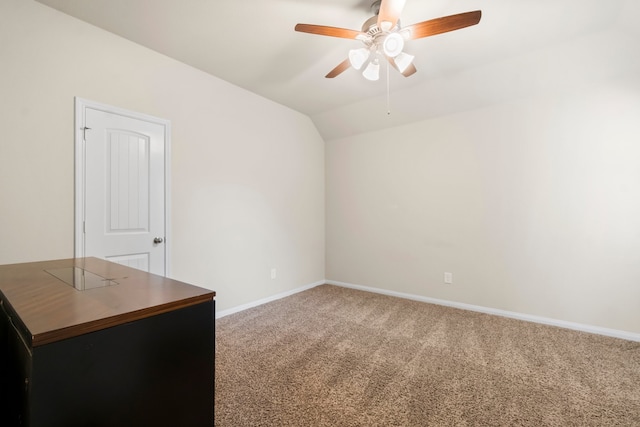 unfurnished room featuring carpet flooring, ceiling fan, and vaulted ceiling