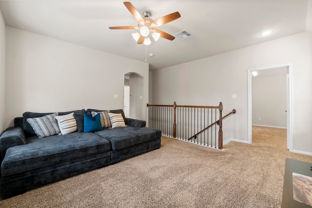 living room featuring ceiling fan and carpet floors