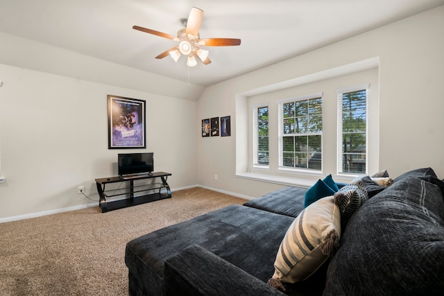 living room featuring carpet floors, vaulted ceiling, and ceiling fan