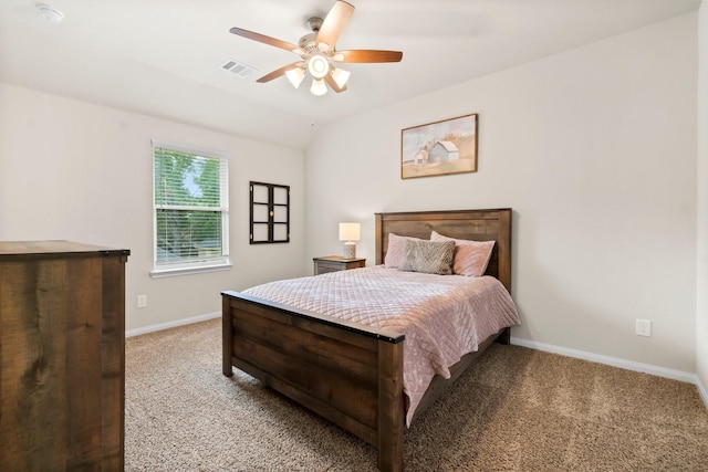 bedroom with ceiling fan, vaulted ceiling, and light carpet