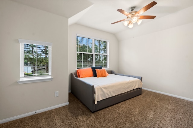 bedroom featuring dark colored carpet, ceiling fan, and lofted ceiling