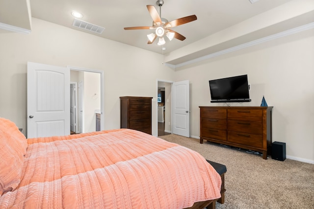 bedroom featuring light carpet, ensuite bath, and ceiling fan