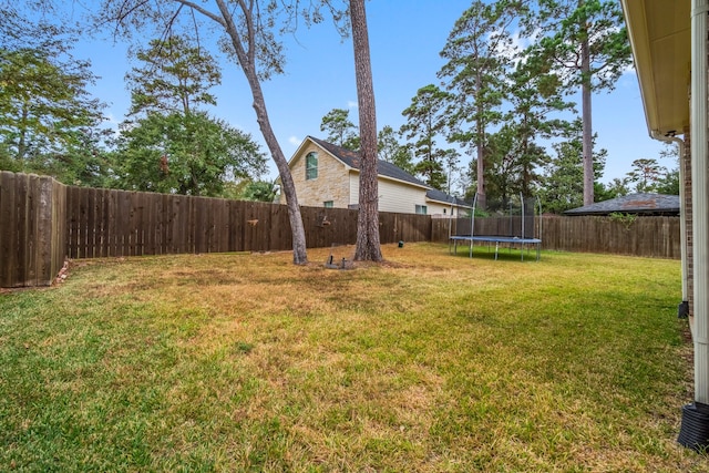 view of yard with a trampoline