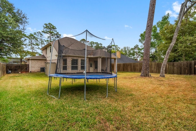 view of yard with a trampoline