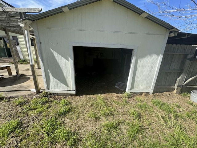 view of home's exterior with an outdoor structure