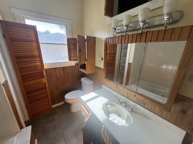 bathroom featuring vanity, toilet, and tile patterned floors