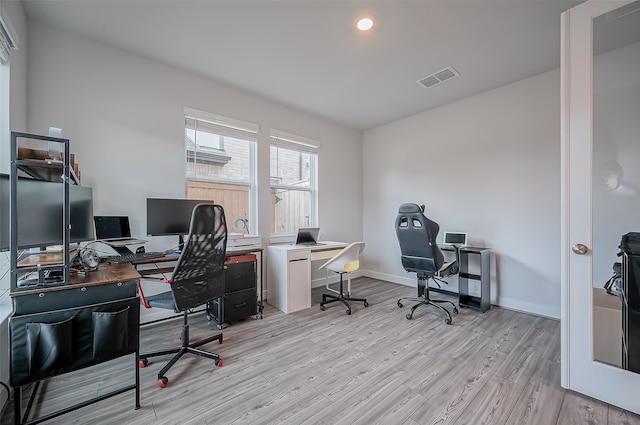 office area with light hardwood / wood-style flooring