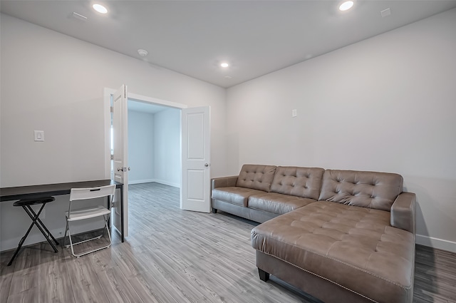 living room with light hardwood / wood-style floors