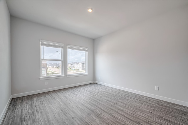 spare room featuring light hardwood / wood-style floors