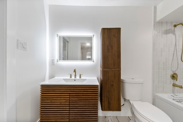 bathroom with toilet and vanity