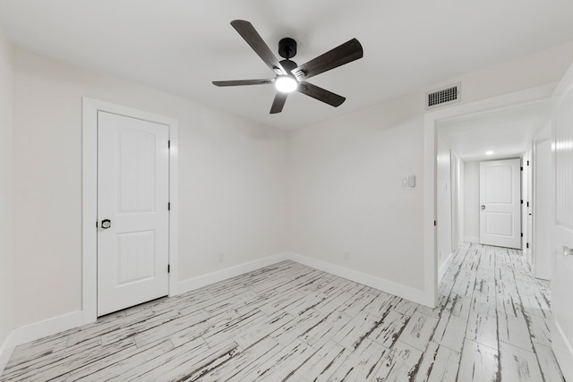 unfurnished room featuring ceiling fan and light hardwood / wood-style floors