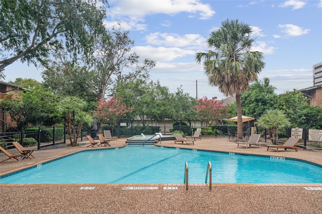 view of pool featuring a patio area