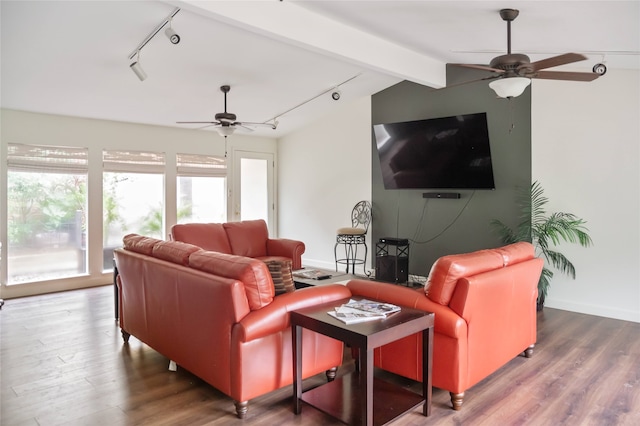 living room with hardwood / wood-style floors, vaulted ceiling with beams, and ceiling fan