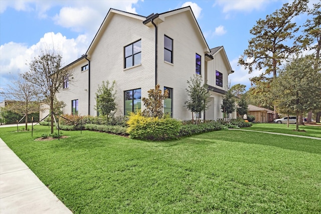 view of home's exterior featuring a lawn