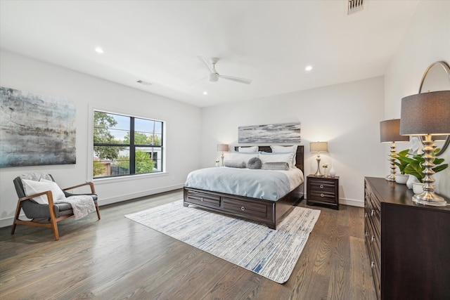 bedroom featuring ceiling fan and dark hardwood / wood-style flooring