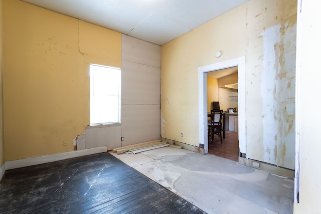 unfurnished room with wood-type flooring