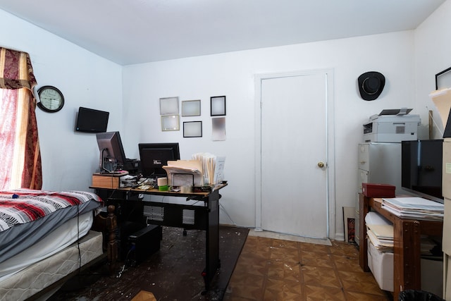 office area with dark parquet flooring