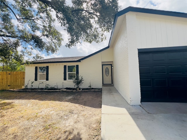 single story home with a garage