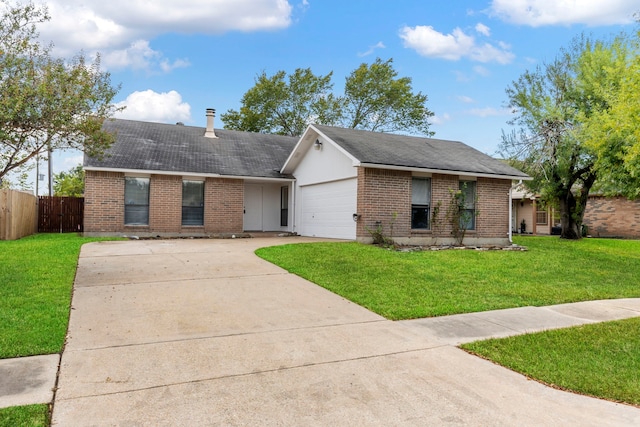 ranch-style house featuring a garage and a front lawn