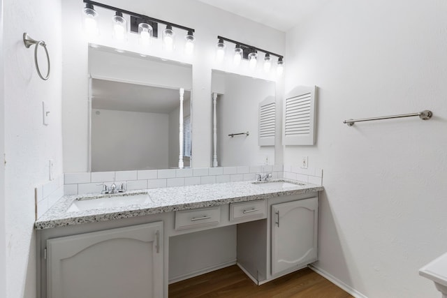 bathroom with hardwood / wood-style flooring and vanity