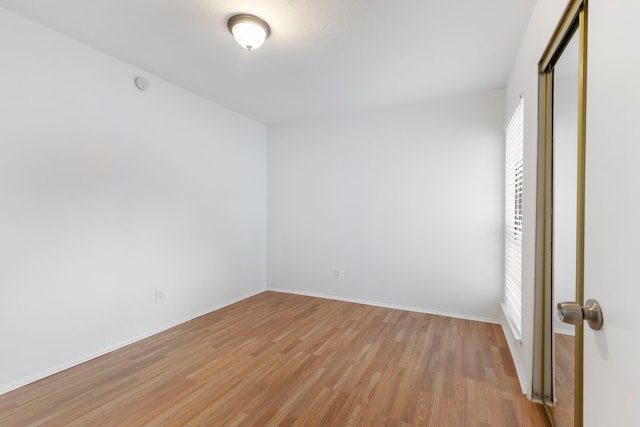 unfurnished room featuring light hardwood / wood-style floors