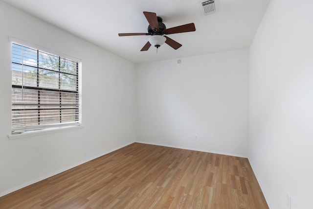 spare room featuring ceiling fan and light hardwood / wood-style flooring