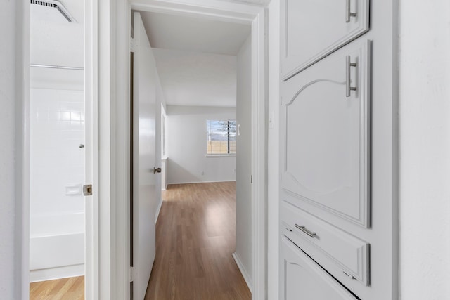 corridor featuring light hardwood / wood-style floors