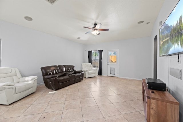 tiled living room with ceiling fan