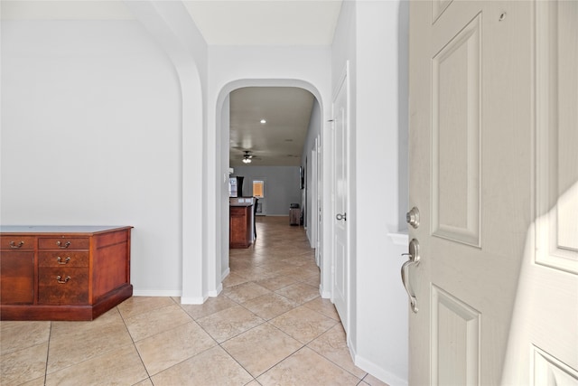 corridor with light tile patterned floors