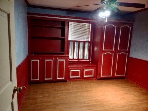 empty room featuring light hardwood / wood-style flooring and ceiling fan